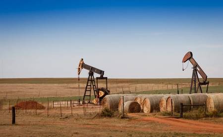 Oil Climbs as OPEC Output Drop Eases Concerns About Glut