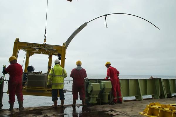 The bespoke drill rig being lowered over the side of the RRS James Cook. The rig is designed to push the curved steel pipe into the seabed sediment. Image: Copyright STEMM-CCS Project