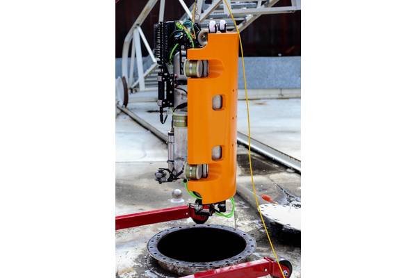 The Nortek DVL1000 leads the way as the inspection vehicle enters a tank. The DVL operates to a high degree of accuracy in the harsh environment inside. Image courtesy Nortek/Square Robot