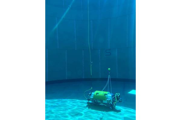 Testing the Square Robot vehicle in a test tank filled with water. The DVL1000, seen on the right, is mounted so it can work unobstructed, while maintaining a minimum distance from the floor. Image courtesy Nortek/Square Robot