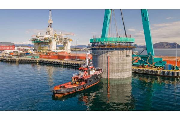 Hywind Tampen structures being floated out of the drydock at Stord, Norway. Photo from Aker Solutions / Lars Melkevik.