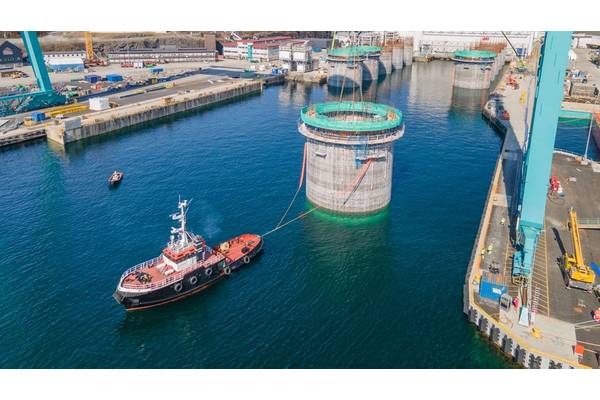 Hywind Tampen structures being floated out of the drydock at Stord, Norway. Photo from Aker Solutions / Lars Melkevik.